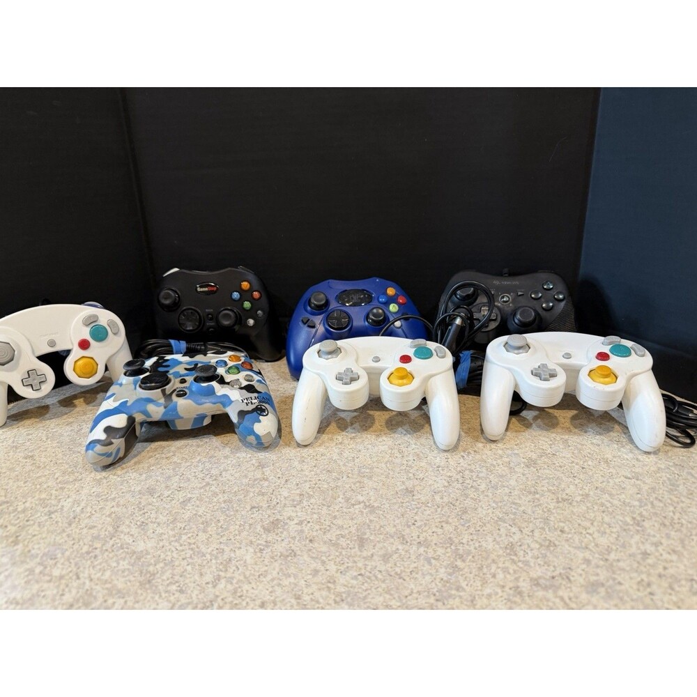 Lot of 7 Mixed Video Game Controllers GameCube Xbox PS Untested Pelican GameStop